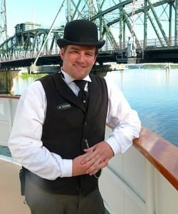 Heritage leader Ryan Downs welcomes passengers aboard the S.S. Legacy.