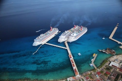 Carnival Corporation's new three-berth pier at the company's Puerto Maya port in Cozumel, the most popular cruise destination in the Caribbean, today welcomed its first trio of ships, all from its Carnival Cruise Line brand -- Carnival Breeze, Carnival Freedom and Carnival Triumph. With an investment of over $20 million, the extra capacity provided by the new "arm" allows more ships to call on Cozumel and more passengers who can visit. In 2014, about 1.6 million passengers from six of the company's 10 brands visited Puerta Maya. Photo courtesy of Carnival Corp.